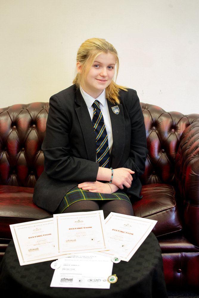 Grace with her Performance Certificates and Medals